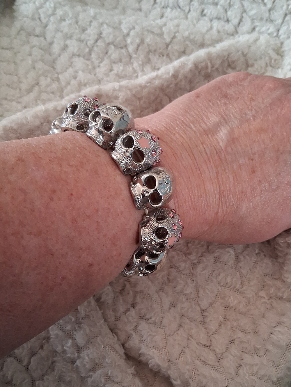 Skull Link Bracelet with Pink Crystal Accents. Stretch